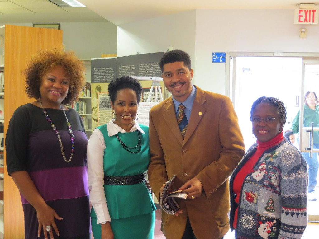 From left, Smithfield Library Branch Manager Yolanda Hardy, Birmingham Public Library Public Relations Director Chanda Temple, New York Times Best Selling author Omar Tyree and Birmingham Public Library board member Gwendolyn Welch.